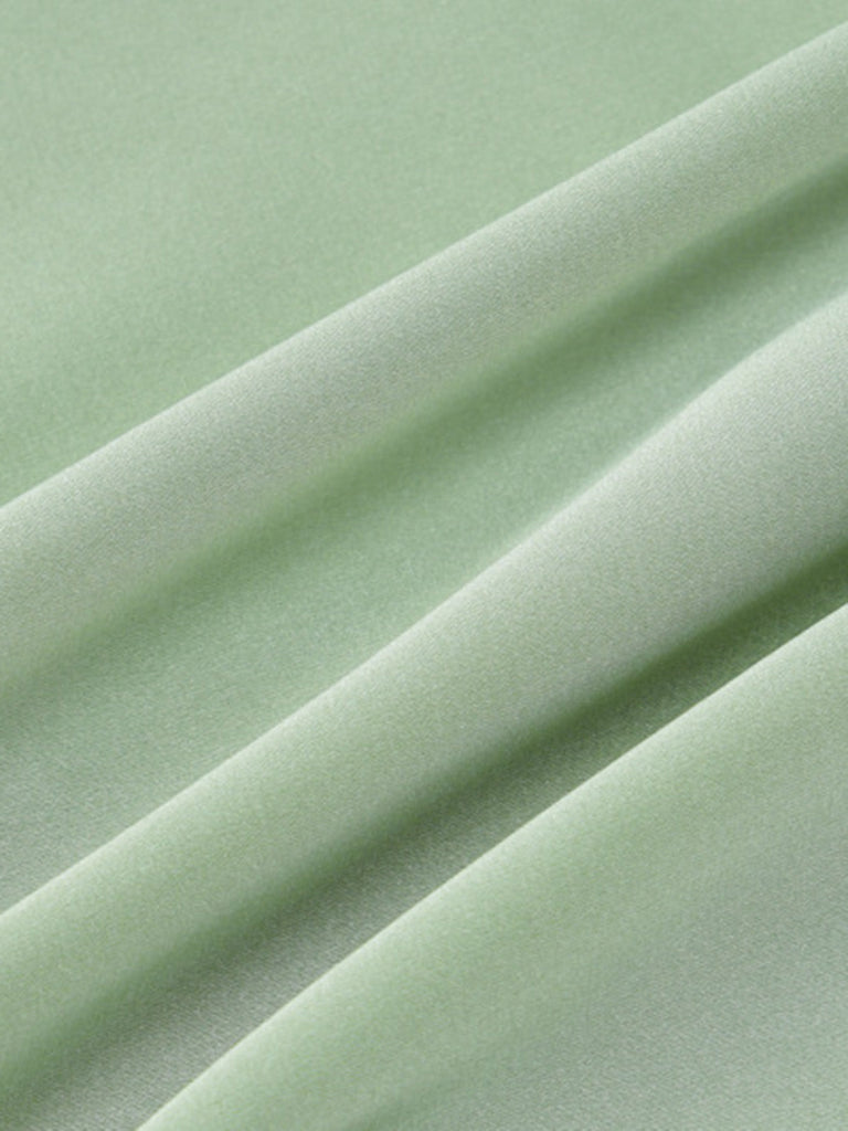 Robe froncée dos nu en satin uni des années 1970