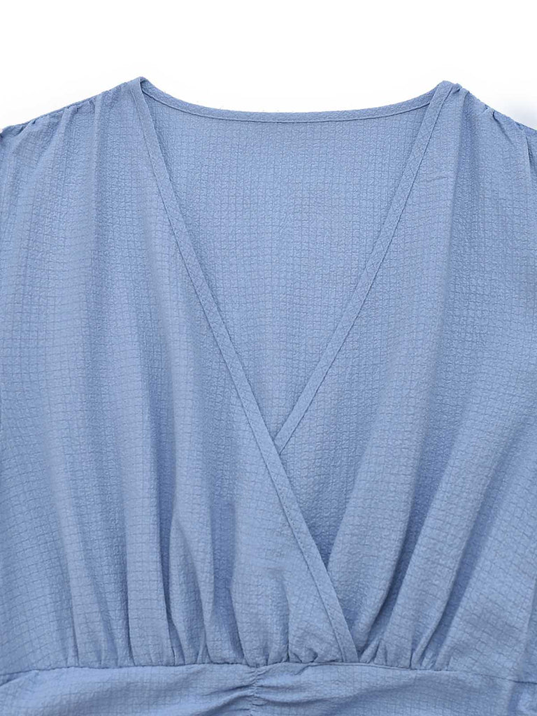 Robe manches volants froncée fendue col V uni des années 1940