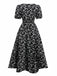 Robe noire à fleurs manches bouffantes à col en V années 1940