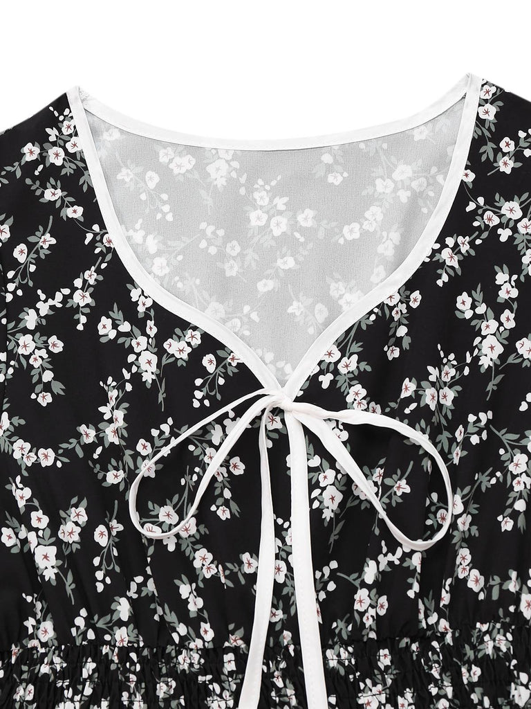 Robe noire à fleurs manches bouffantes à col en V années 1940