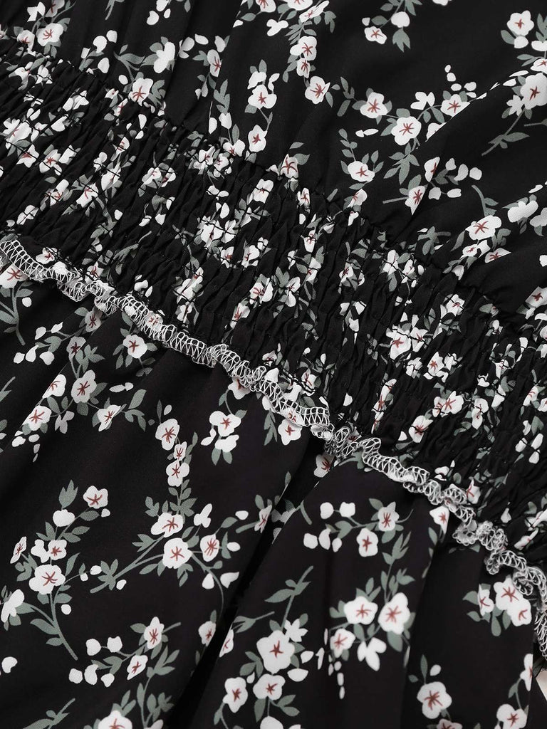 Robe noire à fleurs manches bouffantes à col en V années 1940