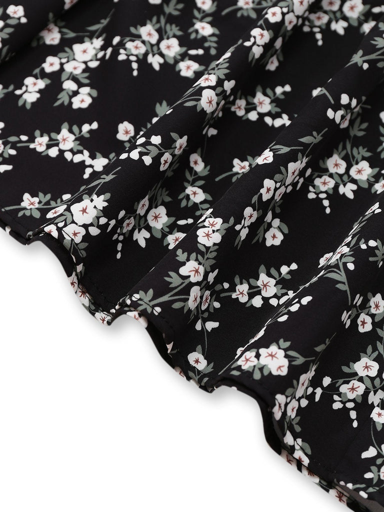 Robe noire à fleurs manches bouffantes à col en V années 1940