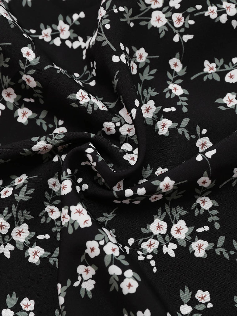 Robe noire à fleurs manches bouffantes à col en V années 1940