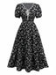 Robe noire à fleurs manches bouffantes à col en V années 1940