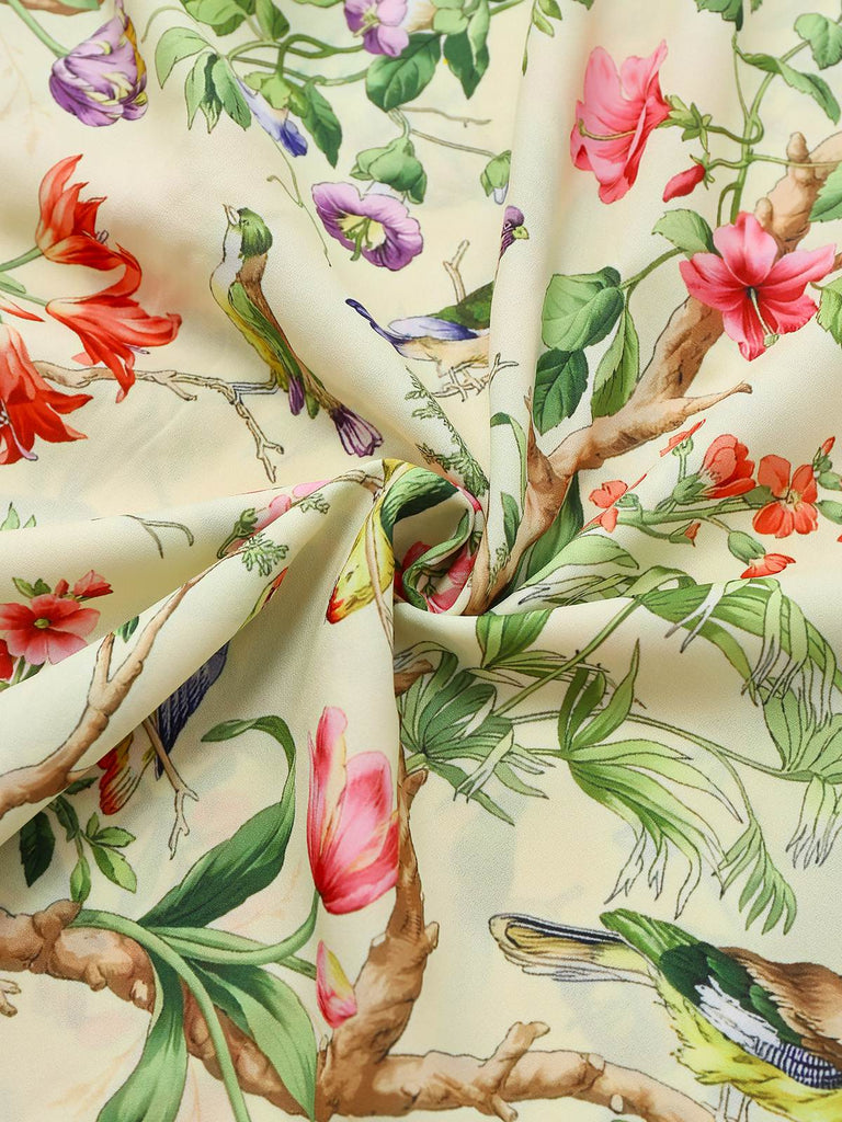 Robe jaune oiseaux et fleurs à volants années 1950