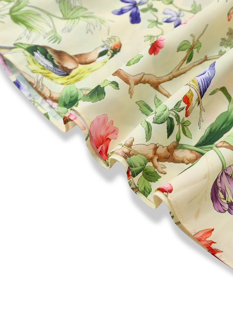 Robe jaune oiseaux et fleurs à volants années 1950