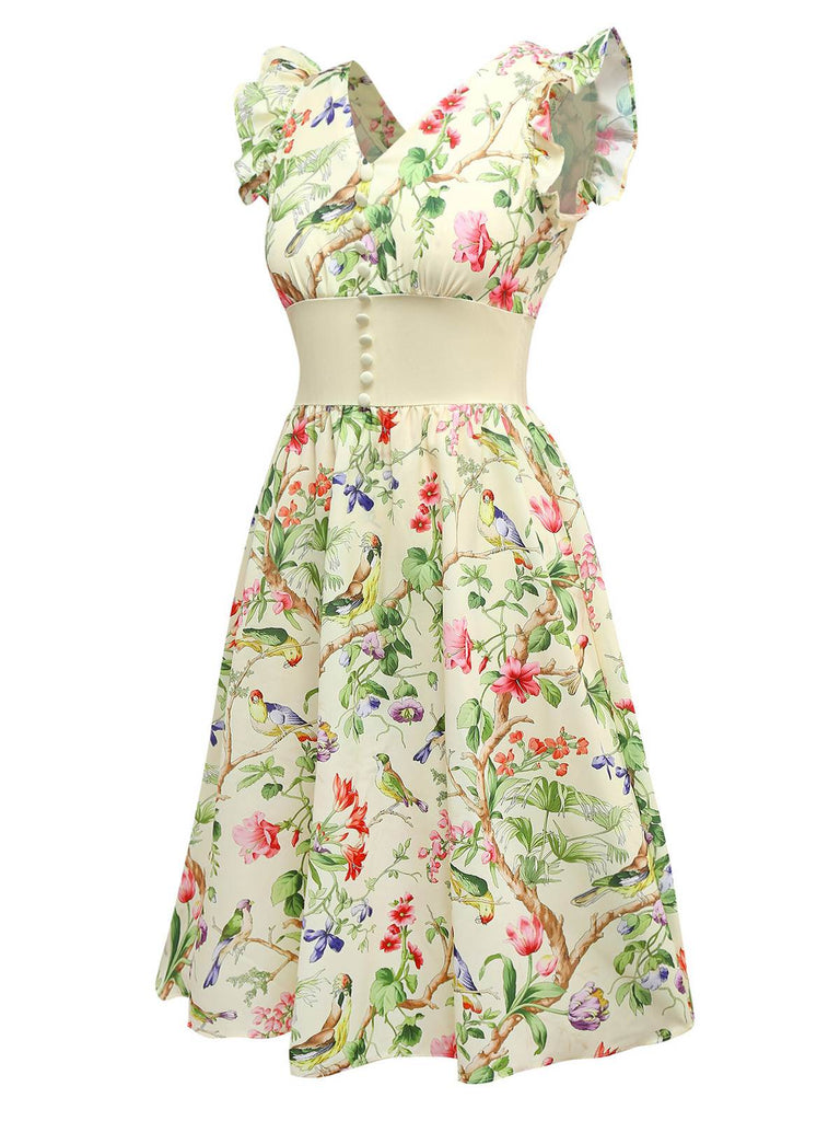 Robe jaune oiseaux et fleurs à volants années 1950