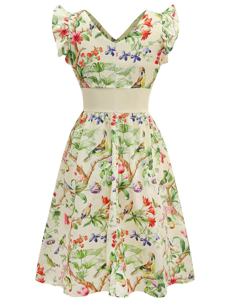 Robe jaune oiseaux et fleurs à volants années 1950