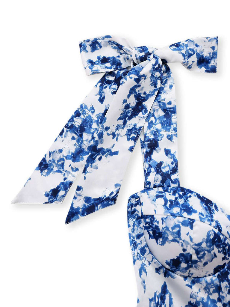 Robe patineuse bleue à fleurs et épaules nouées années 1960