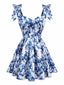 Robe patineuse bleue à fleurs et épaules nouées années 1960