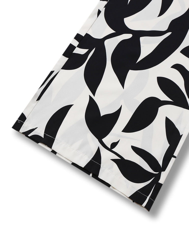 Combinaison noire à bretelles spaghetti et silhouette de feuille des années 1930