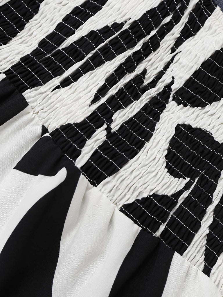 Combinaison noire à bretelles spaghetti et silhouette de feuille des années 1930