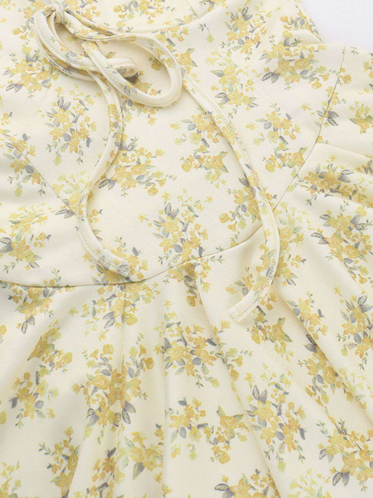 Robe jaune à fleurs et col en V manches bouffantes années 1960