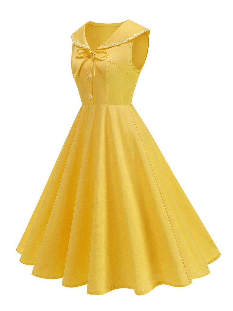 Robe sans manches col marin et nœud papillon couleur unie années 1950