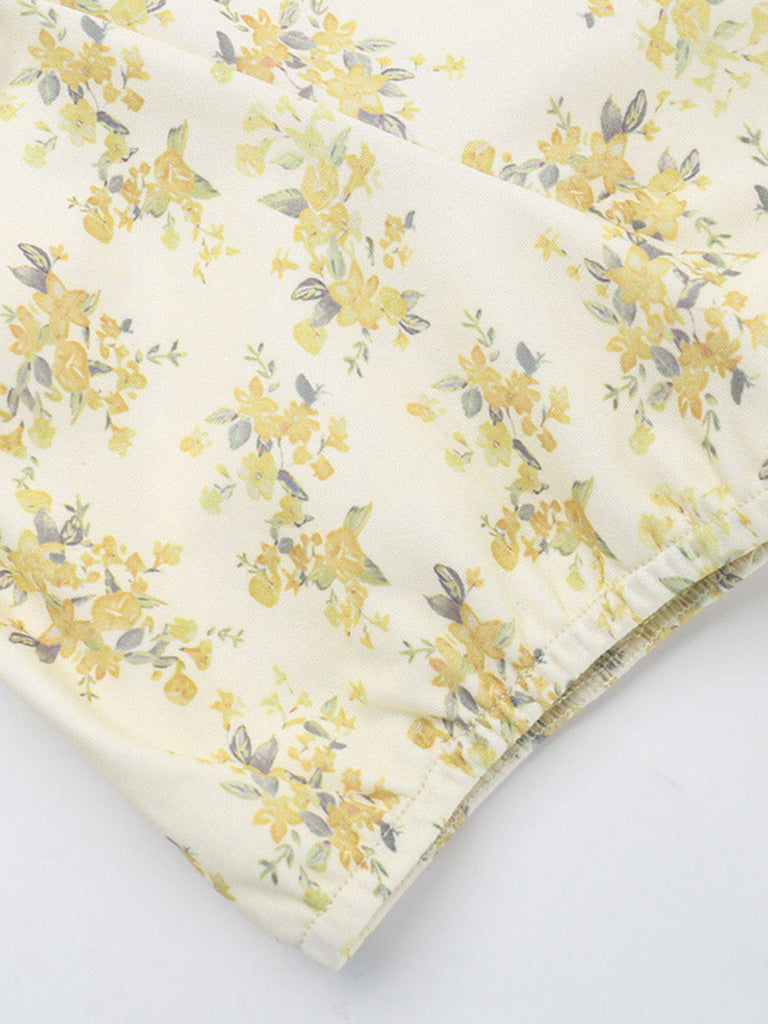 Robe jaune à fleurs et col en V manches bouffantes années 1960