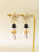 Boucles d'oreilles bonhomme de neige en strass flocons de neige et perles