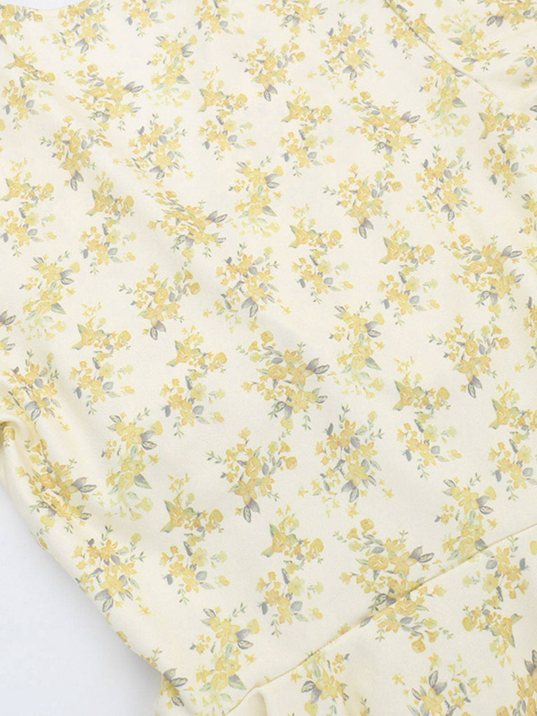 Robe jaune à fleurs et col en V manches bouffantes années 1960