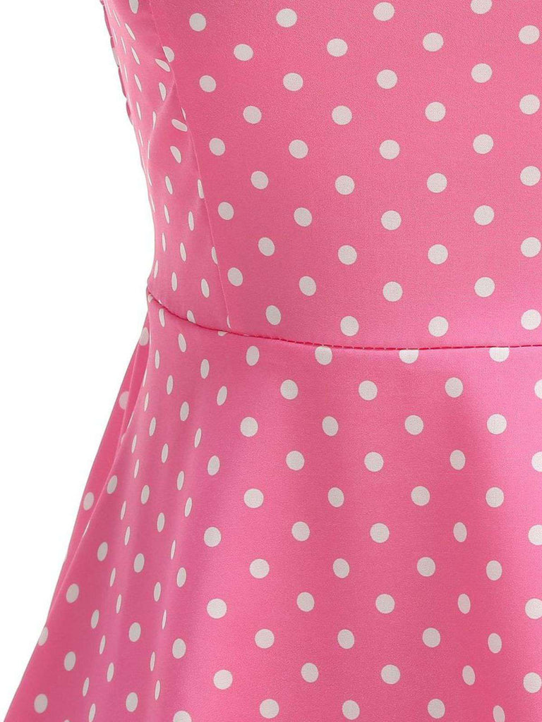Robe swing ceinturée col halter à pois années 50