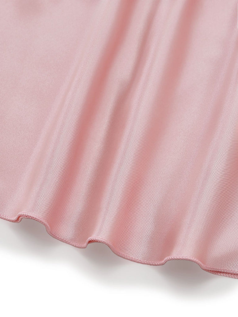 Close-up of a pink fabric with a subtle texture on a white background