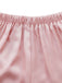 Close-up of pink fabric with a white background