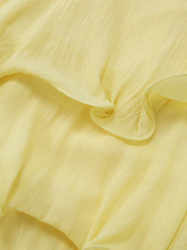 Close-up of light yellow fabric with ruffled edge