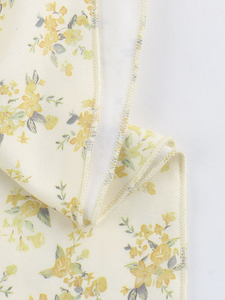 Robe jaune à fleurs et col en V manches bouffantes années 1960