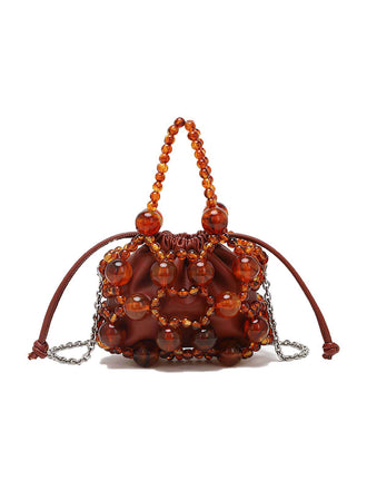 Mini sac seau à cordon de serrage et perles métalliques