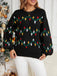 Pull en tricot noire à motifs de lumières de Noël années 1960