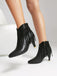 Bottines Chelsea à bout pointu et pompons métalliques