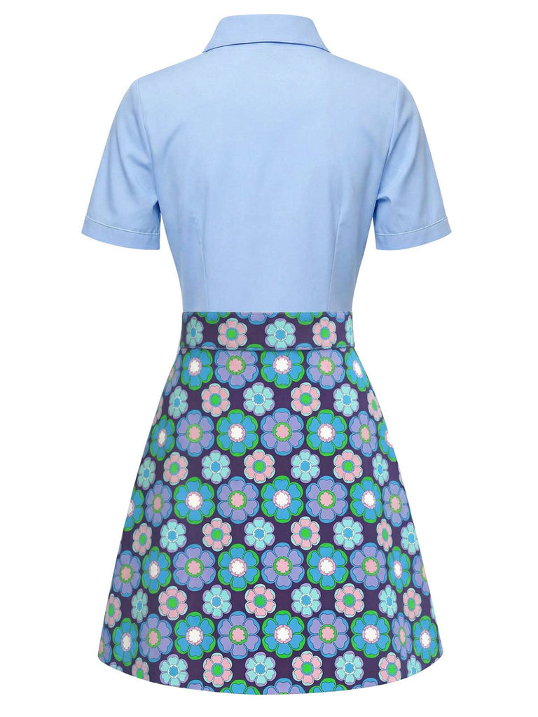 Light blue polo shirt with a colorful floral skirt on a white background