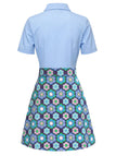 Light blue polo shirt with a colorful floral skirt on a white background