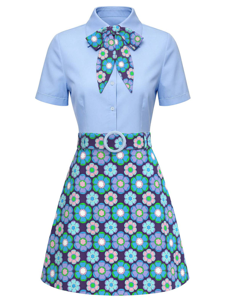 Robe bleu clair avec nœud et jupe à motifs floraux sur fond blanc