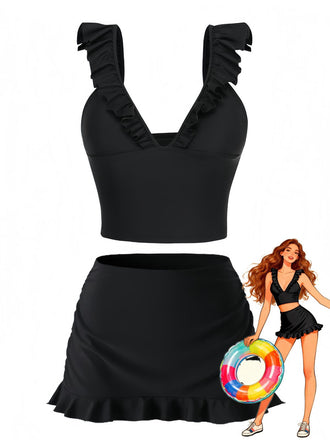 Maillot de bain deux pièces noir avec détails à volants et bouée gonflable colorée sur fond blanc.