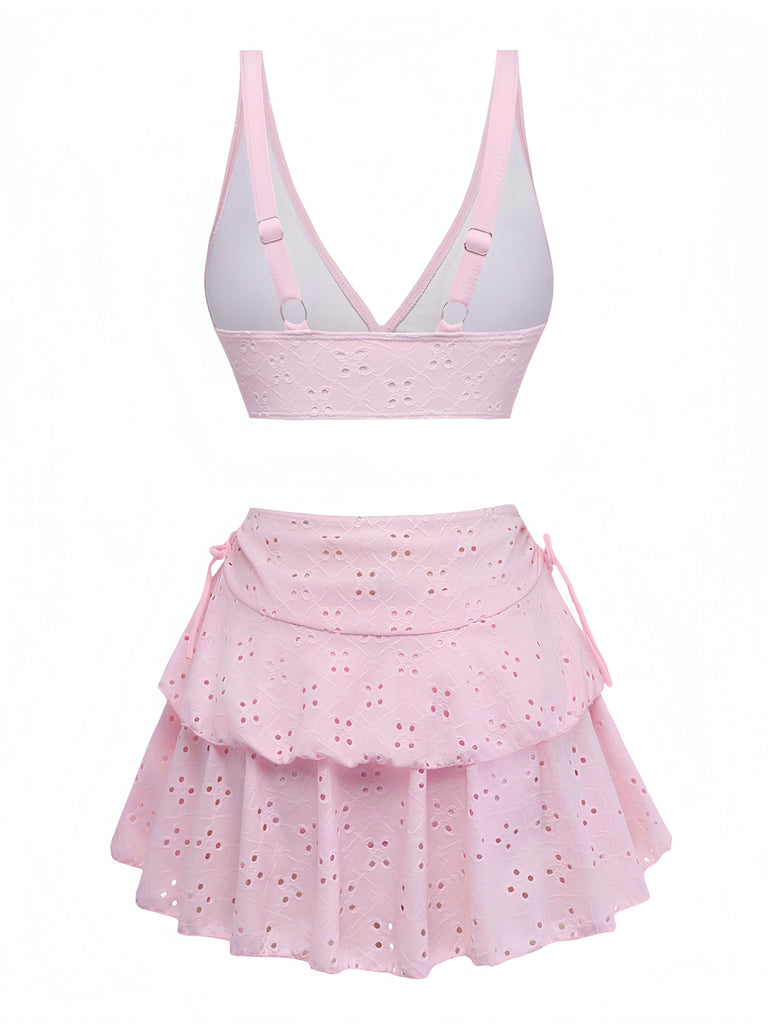Pink two-piece outfit with a skirt and top on a white background