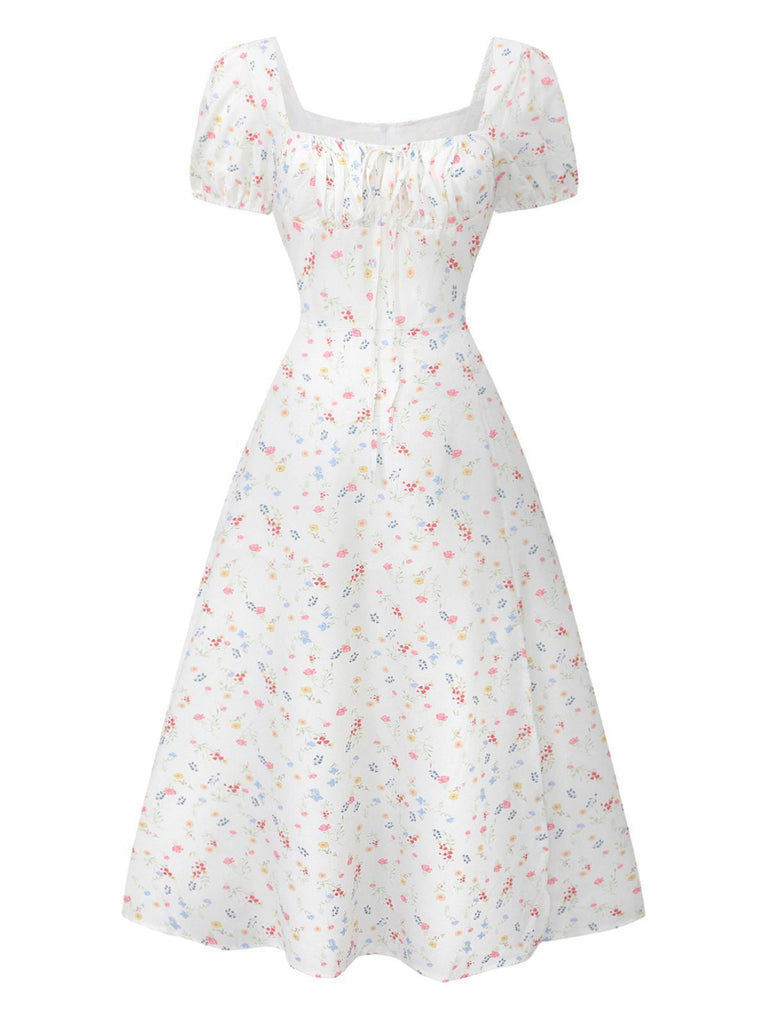 Robe blanche à fleurs col carré et manches bouffantes années 1930