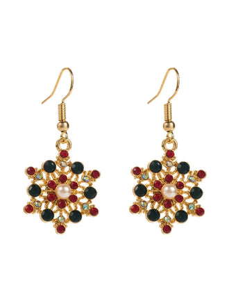 Boucles d'oreilles en strass et chapeau de Noël et un flocon de neige