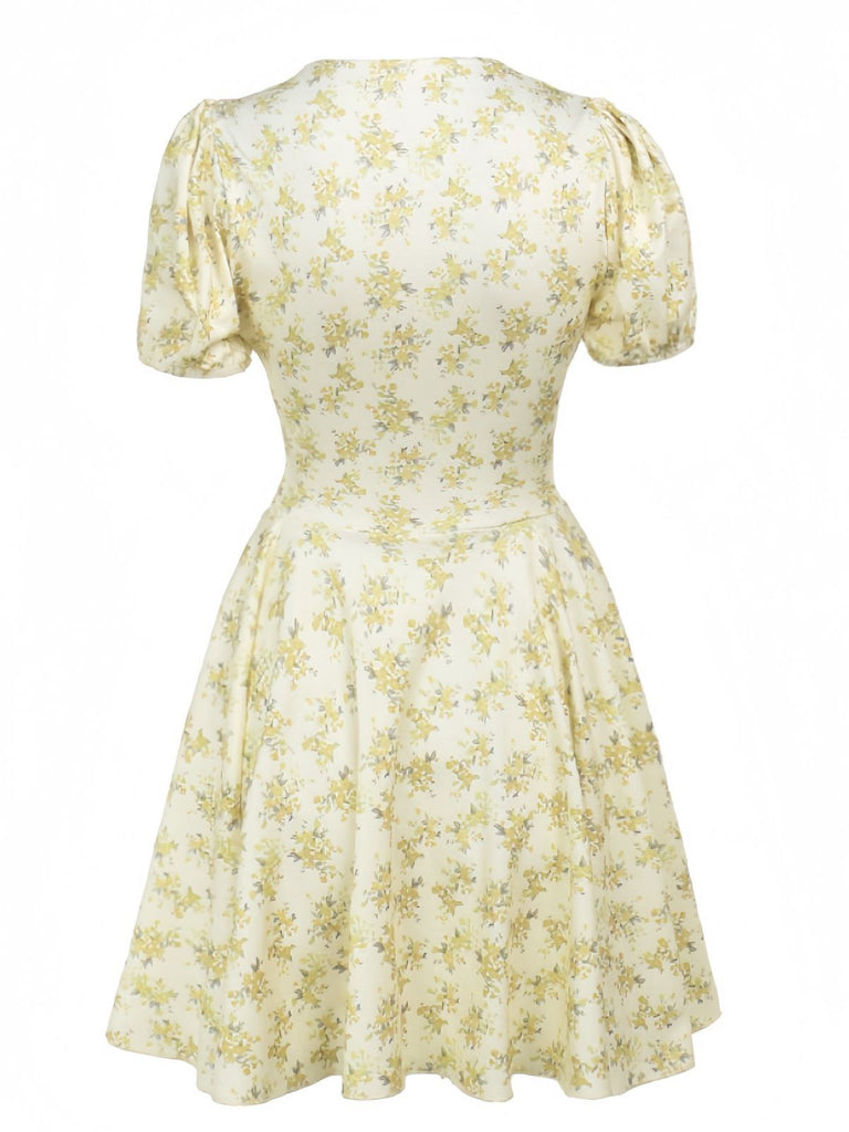 Robe jaune à fleurs et col en V manches bouffantes années 1960