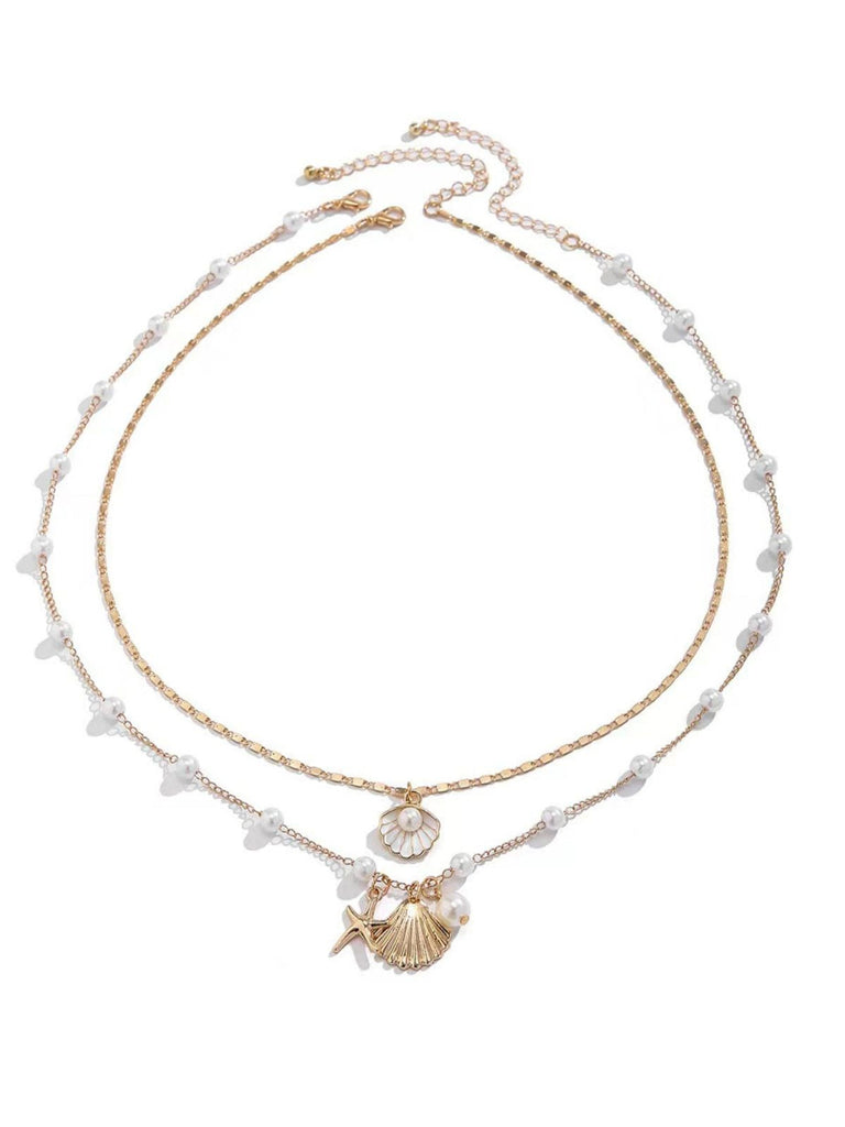Collier superposé en coquillages perles et étoiles de mer