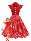 Robe trapèze à pois col nœud manches cape des années 1950