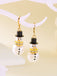 Boucles d'oreilles bonhomme de neige en strass flocons de neige et perles