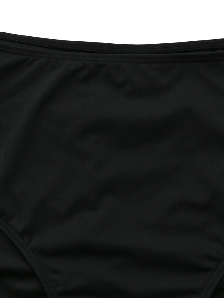 Black vintage tankini with crisscross cutout details and lace-up design in 1940s style