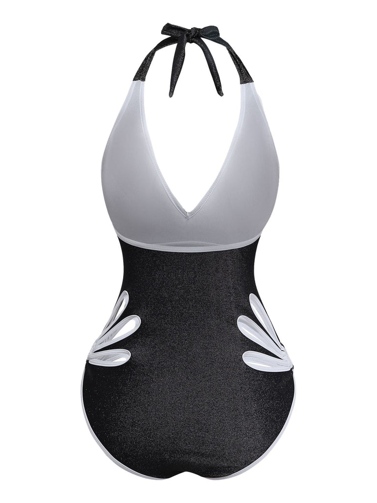 Black and white swimsuit with a halter neck design on a white background
