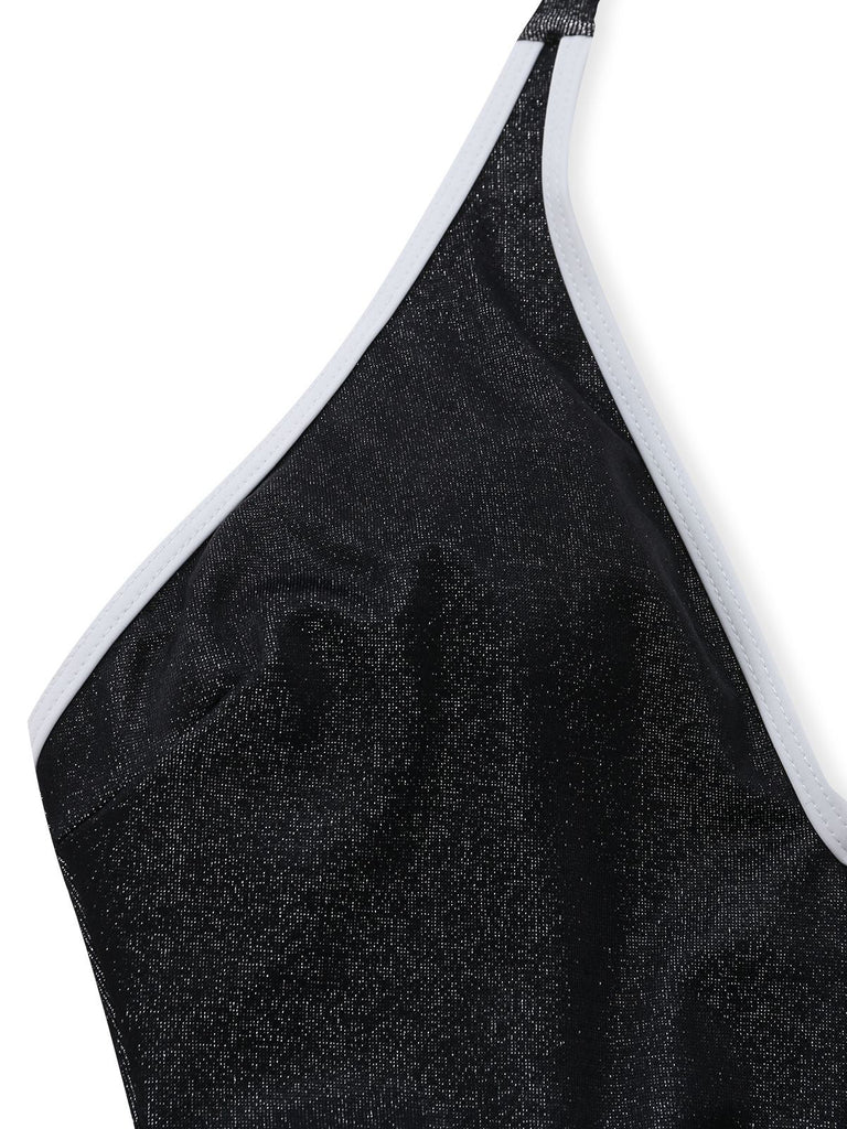 Black glittery swimsuit top with white trim on a white background