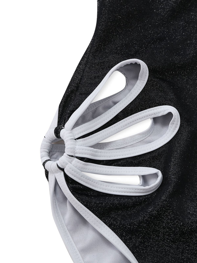 Close-up of a black and white shoe with a unique sole design on a white background