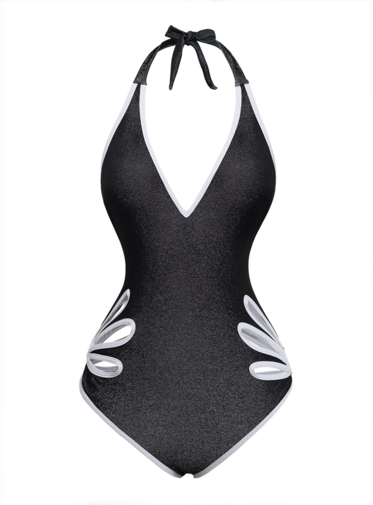 Black one-piece swimsuit with white floral details on a white background