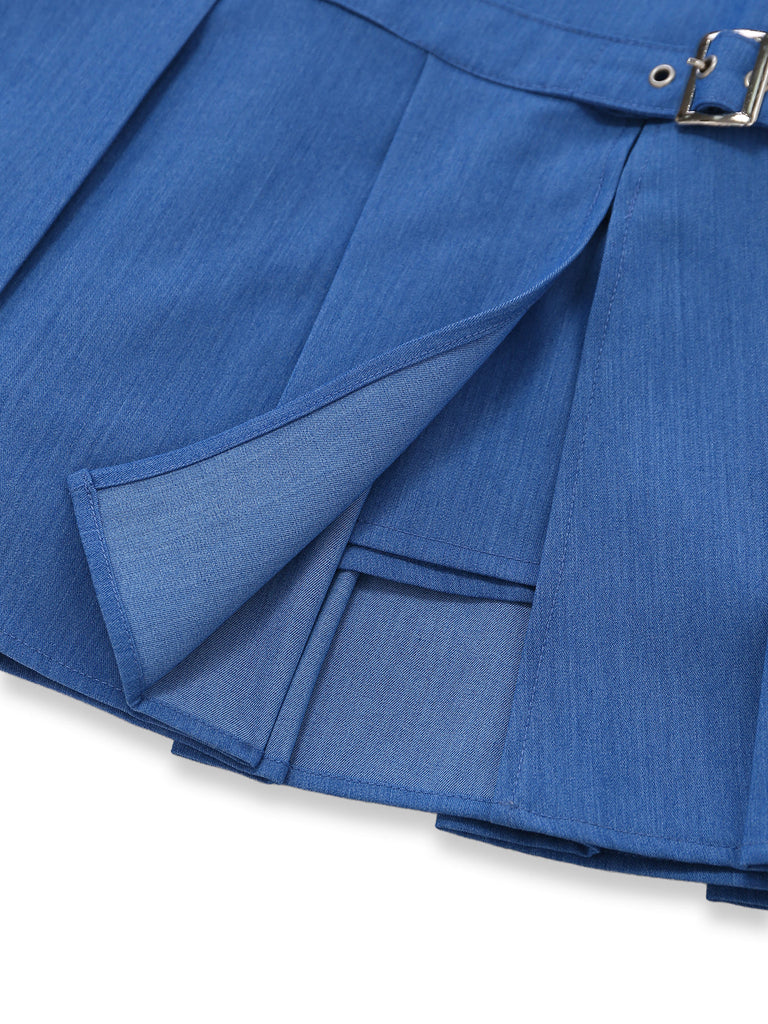 Close-up of a blue pleated skirt with a buckle on a white background