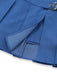 Close-up of a blue pleated skirt with a buckle on a white background