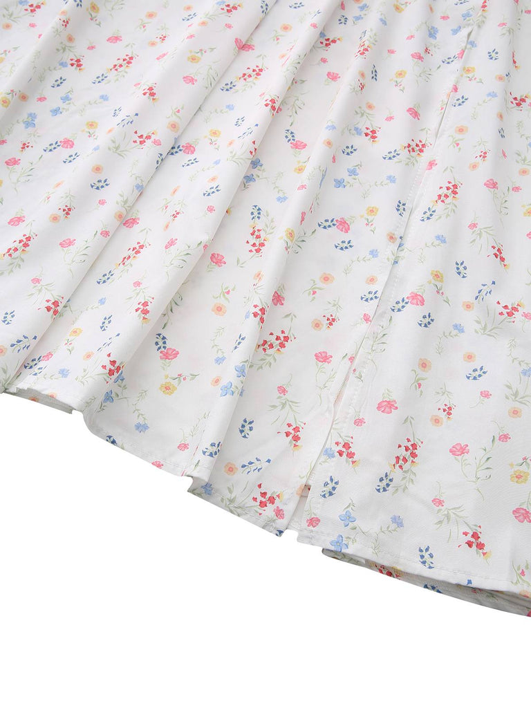 Robe blanche à fleurs col carré et manches bouffantes années 1930