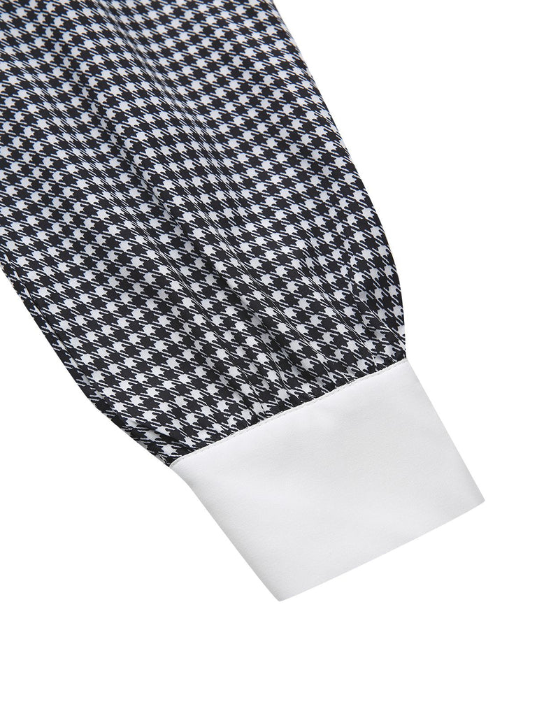 Robe noire à manches bouffantes et boutons nacrés style pied-de-poule années 1940