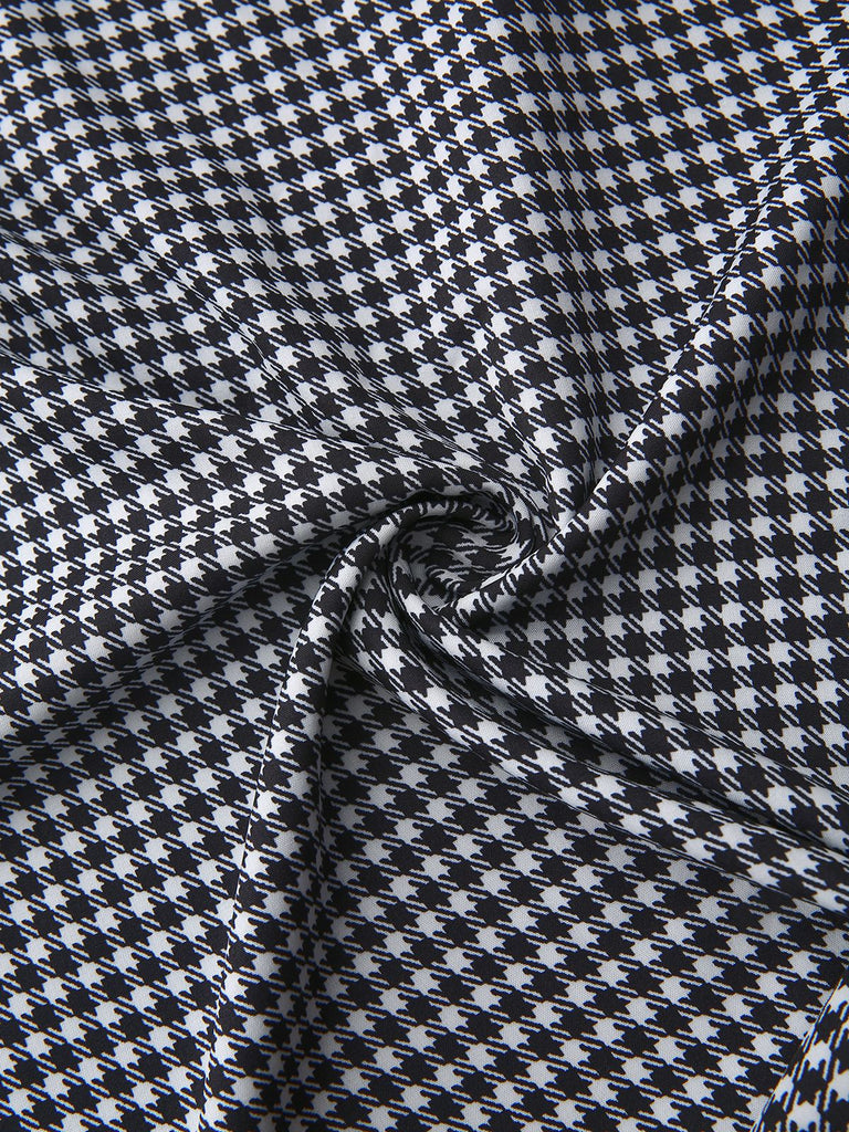 Robe noire à manches bouffantes et boutons nacrés style pied-de-poule années 1940